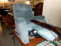 A green/blue fabric manual recliner arm chair