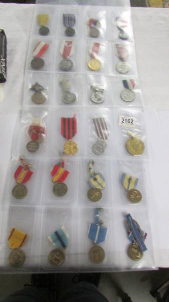 Approximately 20 military and other medals with ribbons, (mainly restrikes).