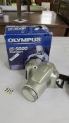 A boxed Olympus IS-5000 camera.