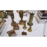 A pair of Heavy bronze anvils on stands, a pair of bronze candlesticks, A trench art vase,