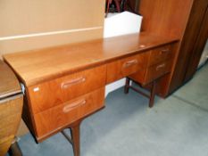 A 1970's teak sideboard, height 75cm,