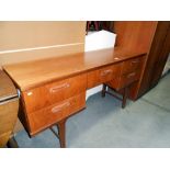 A 1970's teak sideboard, height 75cm,