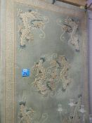 A Chinese carpet with central dragon and dragons in each corner, 184 x 123 cm.