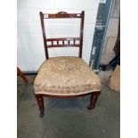 A Victorian nursing chair on casters