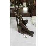 An art deco seated nude female figure. (RD. 796953).