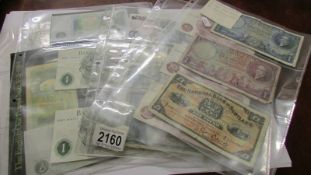 A mixed lot of English and Scottish bank notes including 13 one pound notes and 3 ten shilling