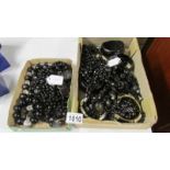 A mixed lot of black bead jewellery.