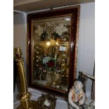 An Victorian sideboard mirror underpainted with flowers, signed J M J and mounted in an old frame.