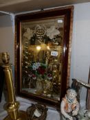 An Victorian sideboard mirror underpainted with flowers, signed J M J and mounted in an old frame.