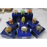 9 boxed Atlas Editions Faberge style eggs with certificates.