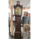 A good Victorian brass faced Grandfather clock marked Bennett, complete with weights and pendulum.