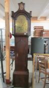 A good Victorian brass faced Grandfather clock marked Bennett, complete with weights and pendulum.