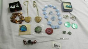 A mixed lot of pendants, necklaces and earrings.