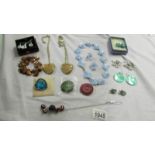 A mixed lot of pendants, necklaces and earrings.