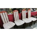 A set of 4 high back dining chairs.