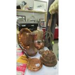 A mixed lot of copper ware including jelly mould, tall jug, wall plaque etc.