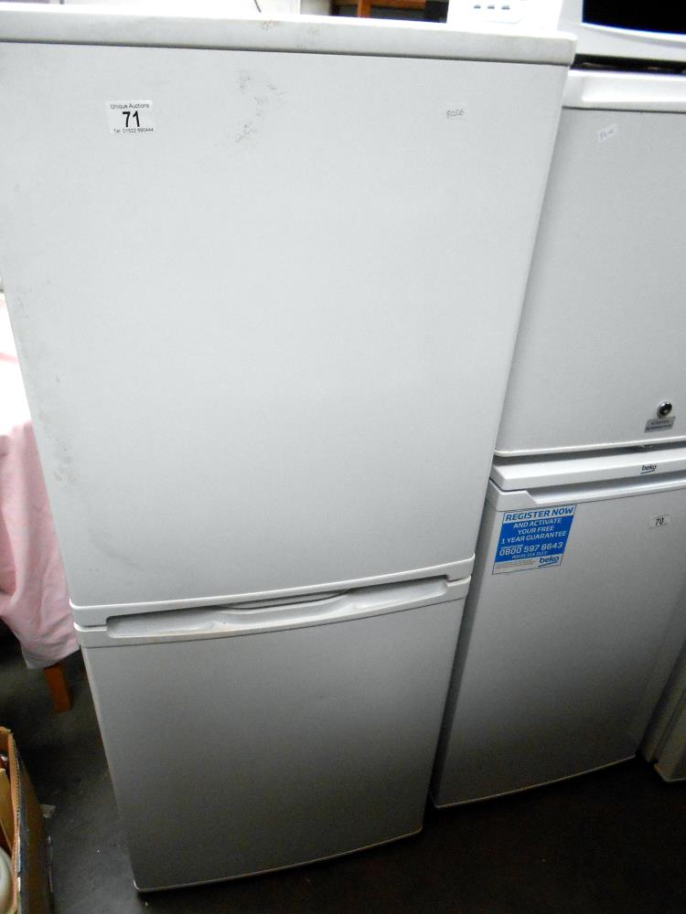 A tall fridge freezer (maker unknown)