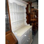 A shabby chic finished solid pine dresser height 197cm, width 107cm approx.
