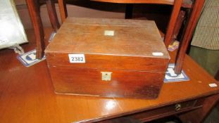 A mahogany sewing box.