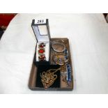 A tray of costume jewellery, bangles,
