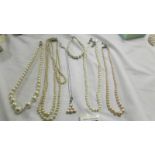 Four 'pearl' necklaces, pendant and bracelet.