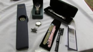 A Cabouchon diamond watch with spare straps and certificate, an Avia watch,