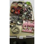 A tray of assorted costume jewellery including rings, bracelets etc.