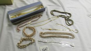 A mixed lot of gold coloured metal jewellery.