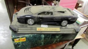 A boxed Maisto Jaguar XJ220 1992 collector's 1:12 model (very dusty).