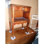 A mahogany cross banded side table, height 68cm, width 43cm approx.