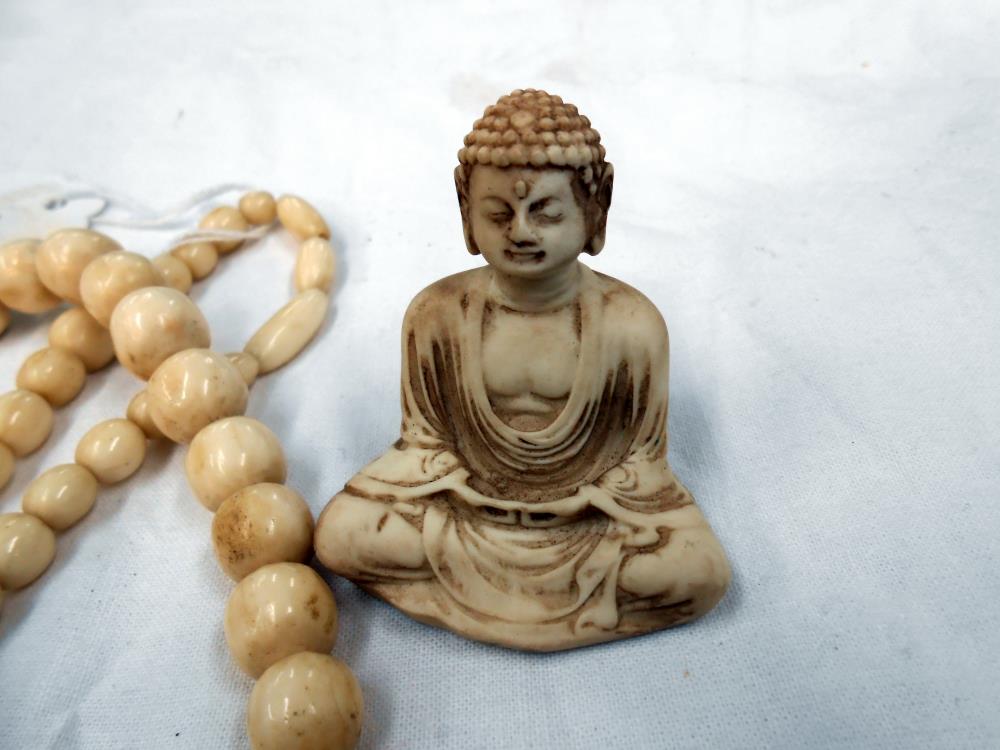 A vintage bone necklace and resin buddah - Image 2 of 2