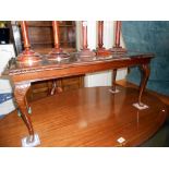 A glass topped dark oak stained long coffee table, Height 43cm,