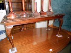 A glass topped dark oak stained long coffee table, Height 43cm,