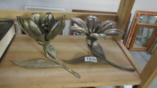 2 silver plated flower ornaments with detachable leaves.