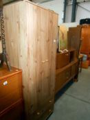A modern 2 door 2 drawer pine effect wardrobe, height 181cm, width 67cm, approx.