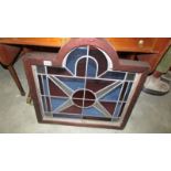 A heavy framed leaded stained glass panel.