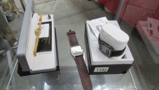 A Pebble smart watch and 2 other wrist watches.