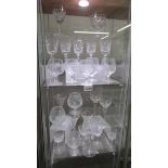 Approximately 25 cut glass wine and other drinking glasses.