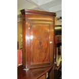 A Victorian mahogany corner cupboard.