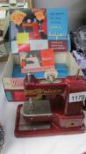 A boxed vintage child's Vulcan sewing machine.