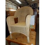 A Lloyd Loom style conservatory chair
