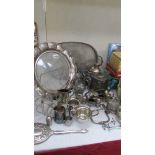 A mixed lot of silver plate including large trays, cruet sets etc.