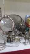 A mixed lot of silver plate including large trays, cruet sets etc.