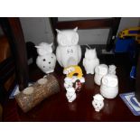 A collection of white porcelain owl ornaments, candles & salt & pepper pots etc.