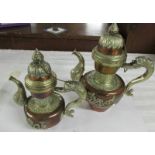 Two copper and white metal Tibetan teapots, 20th century, 28 and 23 cm tall.