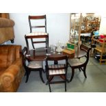 A darkwood stained oval dining table and 4 chairs