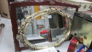 A mahogany framed mirror and one other.