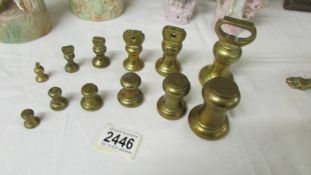 2 sets of 6 brass weights.