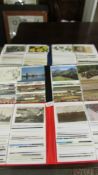 Three albums of mixed postcards including topographical, transport etc.
