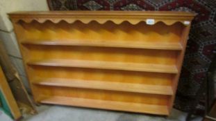 A set of pine wall shelves.